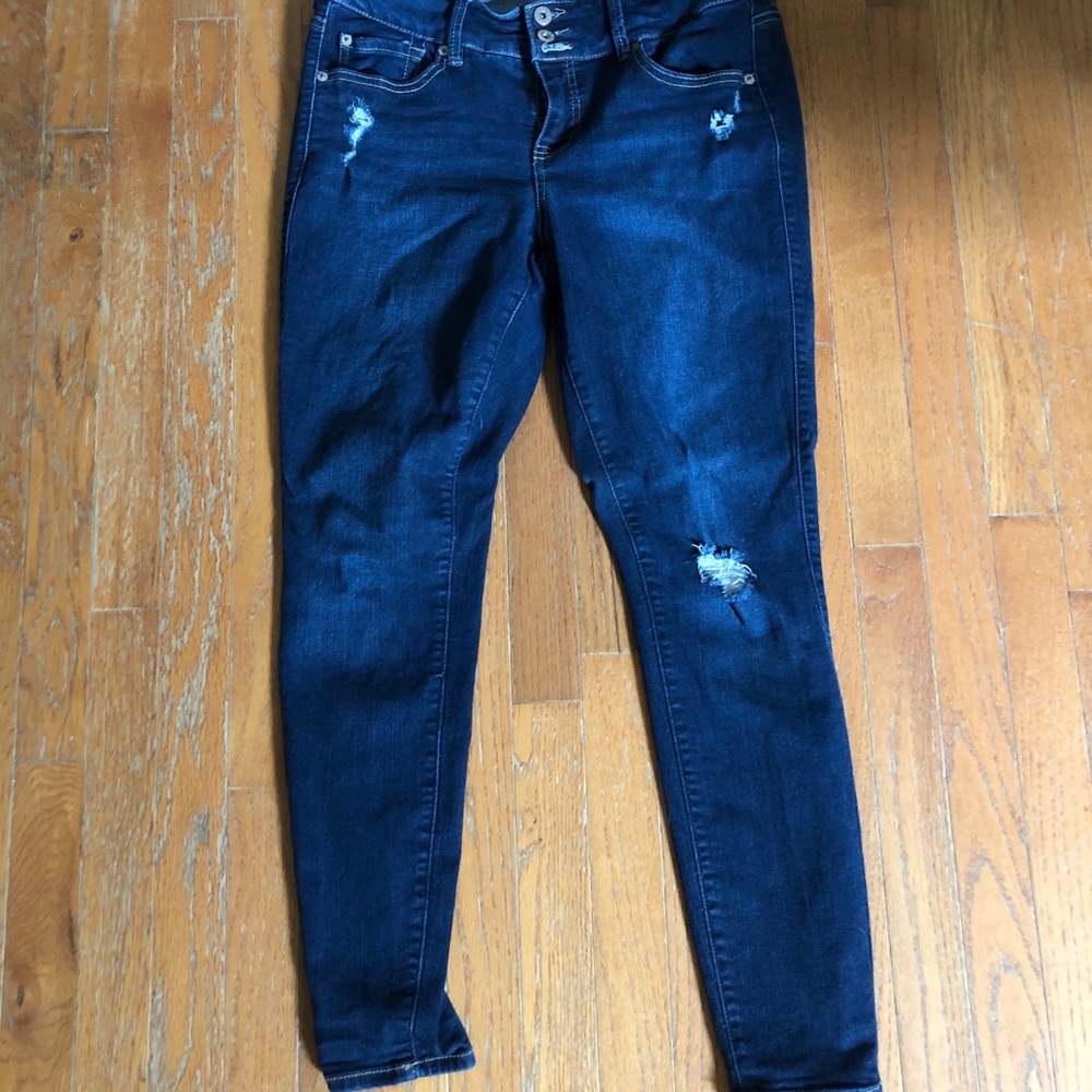 Dark blue slightly ripped jeans